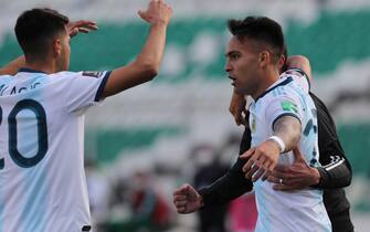epa08742218 Lautaro Martinez (R) of Argentina celebrates after scoring, during a South American qualifying match for the Qatar 2022 World Cup, between the Bolivian and Argentine teams, at the Hernando Siles Stadium, in La Paz, Bolivia, 13 October 2020.  EPA/Martin Alipaz / POOL