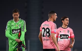 Juventus' goalkeeper Wojciech Szczesny from Poland (L), Juventus' defender Merih Demiral from Turkey (C) and Juventus' forward Paulo Dybala from Argentina wear the special edition of Juventus pink jersey designed by Pharrell Williams during the Italian Serie A football match Juventus vs Verona at the Allianz Stadium in Turin, on October 25, 2020. (Photo by MARCO BERTORELLO / AFP) (Photo by MARCO BERTORELLO/AFP via Getty Images)