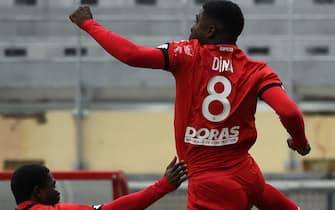 Dijon's French midfielder Eric Dina-Ebimbe (R) celebrates after scoring a goal during the French L1 football match between Dijon (DFCO) and Montpellier (MHSC) on September 27, 2020, at the Gaston-Gerard stadium in Dijon. (Photo by JEAN-PHILIPPE KSIAZEK / AFP) (Photo by JEAN-PHILIPPE KSIAZEK/AFP via Getty Images)
