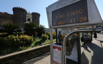 1229795727 A bus stop sign opposite the Castel Nuovo reads "Ciao Diego" a day after the death of Argentinian football legend Diego Maradona, on November 26, 2020 in Naples, southern Italy. - Maradona, widely remembered for his "Hand of God" goal against England in the 1986 World Cup quarter-finals, died on November 25, 2020 of a heart attack at his home near Buenos Aires in Argentina, while recovering from surgery to remove a blood clot on his brain. (Photo by Carlo Hermann / AFP) (Photo by CARLO HERMANN/AFP via Getty Images)
