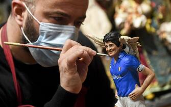 Figurines depicting Diego Armando Maradona (realized by artist Genny Di Virgilio) who will be featured in the traditional Neapolitan Presepio (crib), Naples, 26 November 2020. Diego Maradona has died at the age of 60 after a heart attack on 25 November 2020. ANSA/CIRO FUSCO