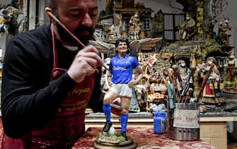 Figurines depicting Diego Armando Maradona (realized by artist Genny Di Virgilio) who will be featured in the traditional Neapolitan Presepio (crib), Naples, 26 November 2020. Diego Maradona has died at the age of 60 after a heart attack on 25 November 2020. ANSA/CIRO FUSCO