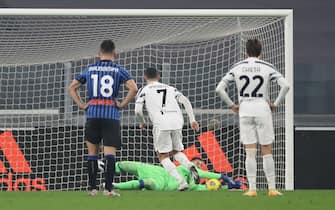 TURIN, ITALY - DECEMBER 16: Pierluigi Gollini of Atalanta saves a second half penalty from Cristiano Ronaldo of Juventus during the Serie A match between Juventus and Atalanta BC at Allianz Stadium on December 16, 2020 in Turin, Italy. (Photo by Jonathan Moscrop/Getty Images)