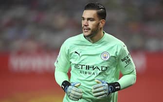 epa08879900 Manchester City's goalkeeper Ederson reacts during the English Premier League soccer match between Manchester United and Manchester City in Manchester, Britain, 12 December 2020.  EPA/Paul Ellis / POOL EDITORIAL USE ONLY. No use with unauthorized audio, video, data, fixture lists, club/league logos or 'live' services. Online in-match use limited to 120 images, no video emulation. No use in betting, games or single club/league/player publications.