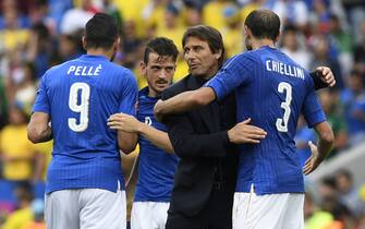 Italy's coach Antonio Conte (2nd R) celebrates with Italy's forward Pelle, Italy's midfielder Alessandro Florenzi and Italy's defender Giorgio Chiellini after the Euro 2016 group E football match between Italy and Sweden at the Stadium Municipal in Toulouse on June 17, 2016. 
Italy won the match 1-0. / AFP / JONATHAN NACKSTRAND        (Photo credit should read JONATHAN NACKSTRAND/AFP/Getty Images)