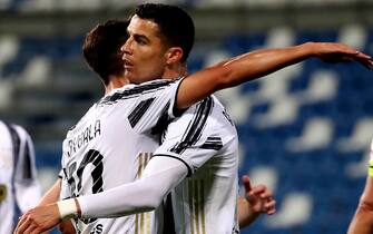 REGGIO NELL'EMILIA, ITALY - MAY 12: Cristiano Ronaldo of Juventus FC celebrates with teammate Paulo Dybala after scoring a goal during the Serie A match between US Sassuolo and Juventus FC at Mapei Stadium - CittÃ  del Tricolore on May 12, 2021 in Reggio nell'Emilia, Italy. (Photo by MB Media/Getty Images)