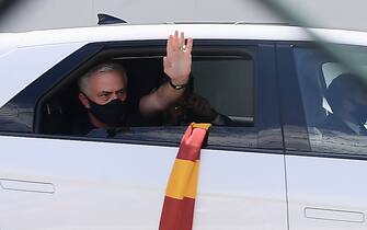 Portuguese football coach Jose Mourinho waves from a car upon his arrival at Rome's Ciampino airport on July 2, 2021. - Jose Mourinho's era as Roma coach is set to begin with the Portuguese due to touch down in the Italian capital on July 2, 2021. The 58-year-old returns to Italy, where he left as a hero back in 2010 after leading Inter Milan to the treble -- Champions League, Serie A and Coppa Italia. Mourinho had only been out of work for 15 days after leaving Tottenham two months ago before his return to Serie A was announced on a three-year deal. (Photo by Filippo MONTEFORTE / AFP) (Photo by FILIPPO MONTEFORTE/AFP via Getty Images)