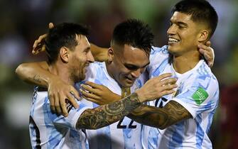 epa09444459 Argentina's Lautaro Martinez (C) celebrates with his teammates Lionel Messi (L) and Joaquin Correa (R) after scoring against Venezuela during the Conmebol qualifiers for the Qatar 2022 World Cup between Venezuela and Argentina, in Caracas, Venezuela, 02 September 2021.  EPA/Miguel Gutierrez / POOL