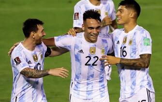 epa09444462 Argentina's Lautaro Martinez (C) celebrates with his teammates Lionel Messi (L) and Joaquin Correa (R) after scoring against Venezuela, during the Conmebol qualifiers for the Qatar 2022 World Cup between Venezuela and Argentina, in Caracas, Venezuela, 02 September 2021.  EPA/Miguel Gutierrez / POOL