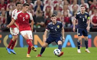 Denmark's Joakim Maehle and Scotland's Billy Gilmour battle for the ball during the 2022 FIFA World Cup Qualifying match at the Parken Stadium, Copenhagen. Picture date: Wednesday September 1, 2021.