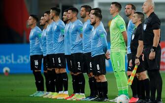 epa09444402 Uruguay's players take part in the protocol acts prior to the Conmebol qualifiers for the Qatar 2022 World Cup between Peru and Uruguay at the National Stadium in Lima, Peru, 02 September 2021.  EPA/Daniel Apuy / POOL