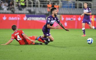 Fiorentina's forward Nicolas Gonzalez (R) vies for the ball with Napoli's midfielder Diego Demme (L) during the Italian Serie A soccer match between ACF Fiorentina and SSC Napoli at the Artemio Franchi stadium in Florence, Italy, 3 October 2021. ANSA/CLAUDIO GIOVANNINI