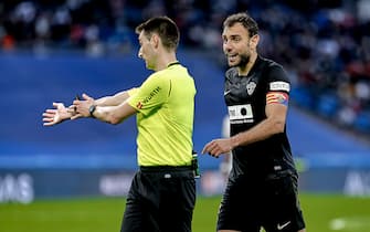 Gonzalo Verdu of Elche CF and the referee Ricardo De Burgos Bengoetxea during the La Liga match between Real Madrid and Elche CF played at Santiago Bernabeu Stadium on January 23, 2021 in Madrid, Spain. (Photo by Alberto Molina / PRESSINPHOTO)