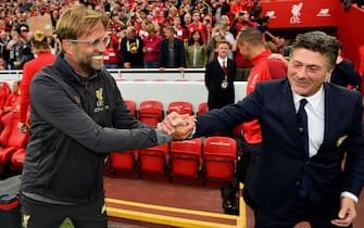LIVERPOOL, ENGLAND - AUGUST 07: (THE SUN OUT, THE SUN ON SUNDAY OUT) Liverpool Manager Jurgen Klopp shakes hands with Walter Mazzarri of Torino before the Pre-Season friendly match between Liverpool and Torino at Anfield on August 7, 2018 in Liverpool, England. (Photo by Andrew Powell/Liverpool FC via Getty Images)