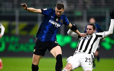 MILAN, ITALY - January 12, 2022: Edin Dzeko of FC Internazionale is challenged by Adrien Rabiot of Juventus FC during the Supercoppa Frecciarossa football match between FC Internazionale and Juventus FC. (Photo by Nicolò Campo/Sipa USA)