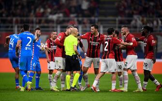 MILAN, ITALY - September 28, 2021: Referee Cuneyt Cakir argues with players of AC Milan during the UEFA Champions League football match between AC Milan and Club Atletico de Madrid. (Photo by Nicolò Campo/Sipa USA)