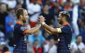 epa09481940 Montpellier HSC's Valere Germain (L) celebrates with teammate Teji Savanier (R) after scoring the opening goal in the French Ligue 1 soccer match between Montpellier HSC and Girondins Bordeaux, Montpellier, France, 22 September 2021.  EPA/Guillaume Horcajuelo