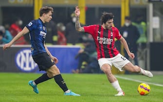 AC Milan's midfielder Sandro Tonali in action against FC Inter's mildfielder Nicolò Barella during the Italian Serie A soccer match FC Inter vs AC Milan at Giuseppe Meazza Stadium in Milan, Italy, 5 February 2022. ANSA / ROBERTO BREGANI