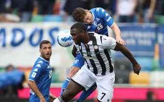 Udinese's Isaac Success (L) and Empoli's Liberato Cacace in action during the Italian Serie A soccer match Udinese Calcio vs Empoli FC at the Friuli - Dacia Arena stadium in Udine, Italy, 16 April 2022. ANSA/GABRIELE MENIS