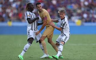 DALLAS, TX - JULY 26: Sergio Busquets #5 of Barcelona and Moise Kean #18 of Juventus FC fight for position during the preseason friendly match between FC Barcelona and Juventus FC at Cotton Bowl on July 26, 2022 in Dallas, Texas. (Photo by Omar Vega/Getty Images)