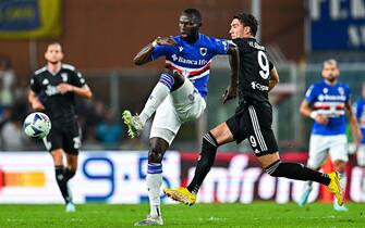 Sampdoria's Gambian defender Omar Colley (left) and Juventus' Serbian forward Dusan Vlahovic vie for the ball during the Italian Serie A soccer match Uc Sampdoria vs Juventus Fc at Luigi Ferraris stadium in Genoa, Italy, 22 August 2022. ANSA/STRINGER