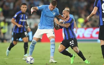 ROME, Italy - 22.08.2022:  Milinkovic Savic (Lazio), Dimarco Federico (INTER) in action during the Italian TIM Serie A football match between SS Lazio vs Fc Inter Milan at Olympic stadium in Rome.