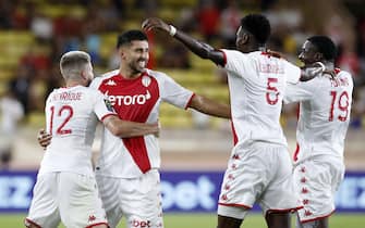 epa10178637 Guillermo Maripan (2-L) of Monaco celebrates with teammates after scoring the 2-0 lead during the French Ligue 1 soccer match between AS Monaco and Olympique Lyon at Stade Louis II in Monaco, 11 September 2022.  EPA/SEBASTIEN NOGIER