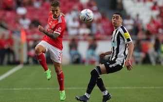 epa10092689 Benfica player Grimaldo (L) in action against Newcastle player Miguel Almiron during the Eusebio Cup friendly soccer match between SL Benfica and Newcastle United held at Luz Stadium, in Lisbon, Portugal, 26 July 2022.  EPA/TIAGO PETINGA