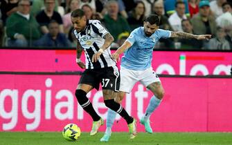 Udinese's Roberto Pereyra (L) and Lazio's Elseid Hysaj in action during the Italian Serie A soccer match Udinese Calcio vs SS Lazio at the Friuli - Dacia Arena stadium in Udine, Italy, 21 May 2023. ANSA / GABRIELE MENIS