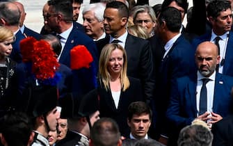 MILAN, ITALY - JUNE 14: Current Italian Prime Minister Giorgia Meloni looks on as the coffin of the late former Italian Prime Minister Silvio Berlusconi leaves Milan Duomo Cathedral prior following his funeral on June 14, 2023 in Milan, Italy. Silvio Berlusconi, the former Italian Prime Minister who bounced back from a series of scandals, died on June 12, 2023 at age 86. His state funeral takes place on June 14, and a national day of mourning has been announced. The politician and businessman, at the time of his death, had the third largest fortune in Italy. According to media estimates, his net worth was between 6 and 7 billion dollars. (Photo by Antonio Masiello/Getty Images)