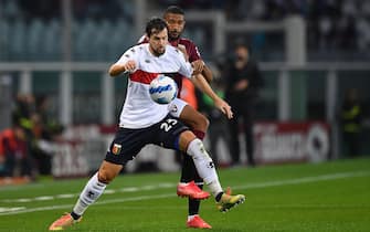 TURIN, ITALY - OCTOBER 22:  Gleison Bremer of Torino FC competes with Mattia Destro of Genoa CFC during the Serie A match between Torino FC and Genoa CFC at Stadio Olimpico di Torino on October 22, 2021 in Turin, Italy.  (Photo by Valerio Pennicino/Getty Images)