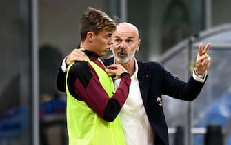 STADIO GIUSEPPE MEAZZA, MILAN, ITALY - 2020/09/24: Stefano Pioli (R), head coach of AC Milan, speaks with Daniel Maldini of AC Milan during the UEFA Europa League Third Qualifying Round football match between AC Milan and FK Bodo/Glimt. AC Milan won 3-2 over FK Bodo/Glimt. (Photo by NicolÃ² Campo/LightRocket via Getty Images)