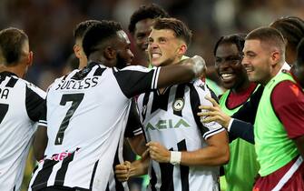Udinese's Lazar Samardzic (C) jubilates with his teammates after scoring the goal during the Italian Serie A soccer match Udinese Calcio vs AS Roma at the Friuli - Dacia Arena stadium in Udine, Italy, 4 September 2022. ANSA / GABRIELE MENIS