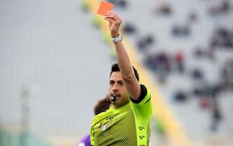 The referee Luca Massimi shows a red card to Empoli's defender Sebastiano Luperto during the Italian serie A soccer match ACF Fiorentina vs Empoli FC at Artemio Franchi Stadium in Florence, Italy, 3 April 2022ANSA/CLAUDIO GIOVANNINI