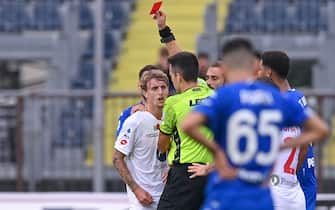 Antonio Rapuano (referee) shows red card to Nicolo Rovella (AC Monza)  during  Empoli FC vs AC Monza, italian soccer Serie A match in Empoli, Italy, October 15 2022