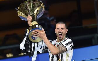 Leonardo Bonucci jubilates with the cup during the celebrations for the Juventus' victory of the 9th consecutive Italian championship (scudetto) at Allianz Stadium in Turin, Italy, 01 August 2020. ANSA/ALESSANDRO DI MARCO