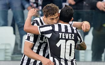 Juventus' Fernando Llorente (L) jubilates with his teammate Carlos Tevez after scoring the goal during the Italian Serie A soccer match Juventus FC vs AS Livorno at Juventus Stadium in Turin, Italy, 07 April 2014.
ANSA/ALESSANDRO DI MARCO