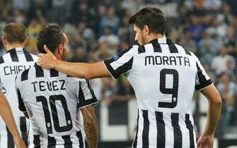 Argentinian forward of Juventus, Carlos Tevez (L), celebrates the victory with his teammate Alvaro Morata at the end of the UEFA Champions League group A soccer match Juventus FC vs Malmoe FF at Juventus Stadium in Turin, Italy, 16 September 2014.
ANSA/DI MARCO