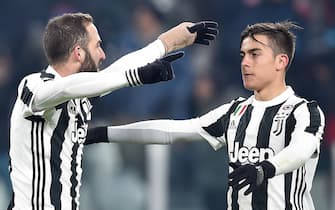 Juventus' Gonzalo Higuain (L) jubilates with his teammate Paulo Dybala after scoring the goal during the Italy Cup round of 16 soccer match Juventus Fc vs Genoa CFC at Allianz Stadium in Turin, Italy, 20 December 2017.
ANSA/ALESSANDRO DI MARCO