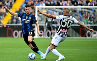 Inter Milan's Croatian midfielder Ivan Perisic (L) is challenged during the Serie A football match between Udinese and Inter Milan at Friuli stadium in Udine on May 1, 2022. (Photo by MIGUEL MEDINA / AFP) (Photo by MIGUEL MEDINA/AFP via Getty Images)