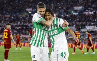 Sassuolo's Armand Lauriente (R) celebrates with his teammate Sassuolo's Domenico Berardi after scoring during the Italian Serie A soccer match between Roma and Sassuolo at the Olimpico stadium in Rome, Italy, 12 March 2023.ANSA/FABIO FRUSTACI