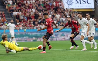 AC Milan’s Tijani Reijnders (C) challenges for the ball  with Lazio’s goalkeeper Ivan Provedel during the Italian serie A soccer match between AC Milan and Lazio at Giuseppe Meazza stadium in Milan, 30 September August 2023.
ANSA / MATTEO BAZZI