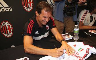 NEW YORK, NY - AUGUST 07:  Massimilano Allegri signs autographs during AC Milan visits Adidas Sport Performance Store on August 7, 2012 in New York City.  (Photo by Donald Bowers/Getty Images for adidas)