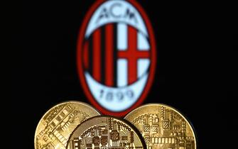 Representation of cryptocurrency is seen with AC Milan football club logo displayed in the background in this illustration photo taken in Krakow, Poland on December 10, 2021. (Photo by Jakub Porzycki/NurPhoto via Getty Images)