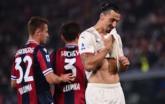 AC Milan's Swedish forward Zlatan Ibrahimovic (R) reacts next to Bologna's Swedish midfielder Mattias Svanberg (L) and Bologna's Scottish midfielder Aaron Hickey (C) during the Italian Serie A football match between Bologna and AC Milan at the Renato-Dall'Ara stadium in Bologna on October 23, 2021. (Photo by Marco BERTORELLO / AFP) (Photo by MARCO BERTORELLO/AFP via Getty Images)