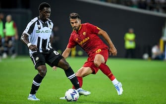 Udinese's Jean-Victor Makengo in action against Roma's Mehmet Celik  during  Udinese Calcio vs AS Roma, italian soccer Serie A match in Udine, Italy, September 04 2022