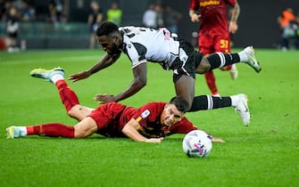 Roma's Roger Ibanez da Silva in action against Udinese's Isaac Success  during  Udinese Calcio vs AS Roma, italian soccer Serie A match in Udine, Italy, September 04 2022