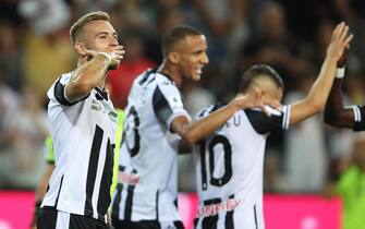 Udinese's Sandi Lovric (L) jubilates with his teammates after scoring the goal during the Italian Serie A soccer match Udinese Calcio vs AS Roma at the Friuli - Dacia Arena stadium in Udine, Italy, 4 September 2022. ANSA / GABRIELE MENIS