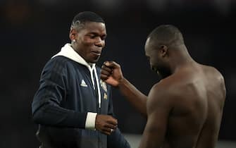 Manchester United's Paul Pogba (left) and Romelu Lukaku celebrate after the final whistle during the UEFA Champions League match at the Parc des Princes, Paris, France.