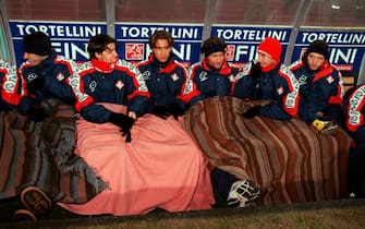 Piacenza's substitutes try to keep warm on the bench  (Photo by Matthew Ashton/EMPICS via Getty Images)